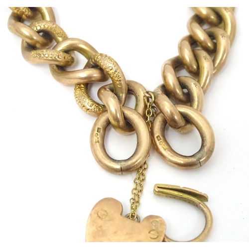752A - A 9ct gold bracelet with padlock formed clasp, maker B&S. Approx. 7 1/2
