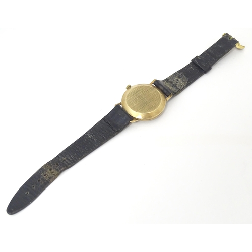 784 - A gents 9ct gold cased Avia 17 jewels incabloc wristwatch with date aperture at 3, hallmarked London... 