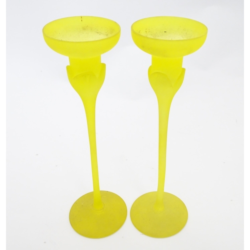 163 - A pair of retro yellow art glass candlesticks. Approx 10 1/2