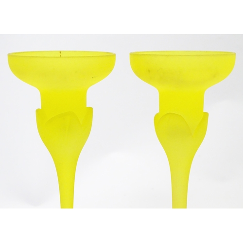 163 - A pair of retro yellow art glass candlesticks. Approx 10 1/2