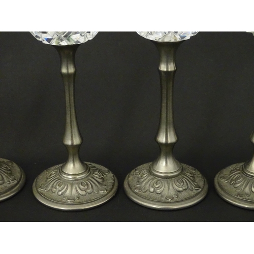 164 - A set of six Italian cut glass champagne flutes raised on  pewter stem and foot. Approx 11