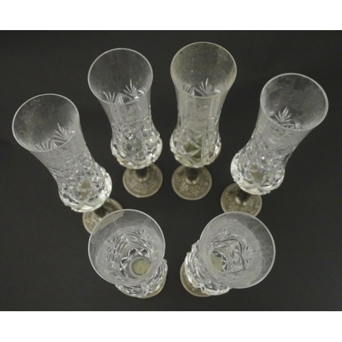 164 - A set of six Italian cut glass champagne flutes raised on  pewter stem and foot. Approx 11