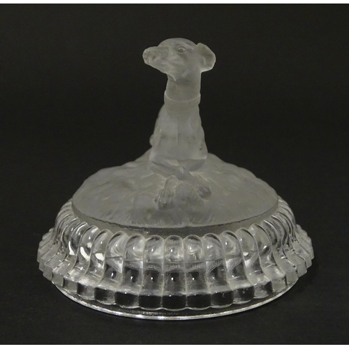 184 - A frosted glass model of a greyhound dog upon a lid formed base. Approx 2 1/2