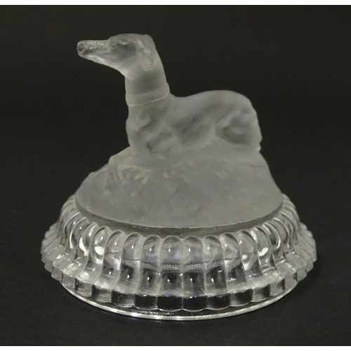 184 - A frosted glass model of a greyhound dog upon a lid formed base. Approx 2 1/2