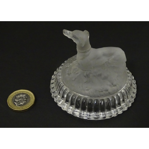 184 - A frosted glass model of a greyhound dog upon a lid formed base. Approx 2 1/2