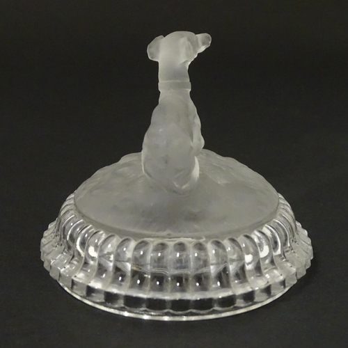 184 - A frosted glass model of a greyhound dog upon a lid formed base. Approx 2 1/2