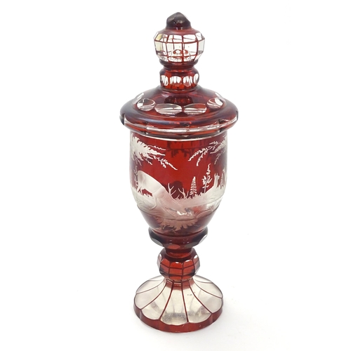 186 - A Victorian Bohemian ruby red and clear glass vase and cover with etched stag  / deer in landscape d... 