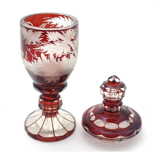 186 - A Victorian Bohemian ruby red and clear glass vase and cover with etched stag  / deer in landscape d... 