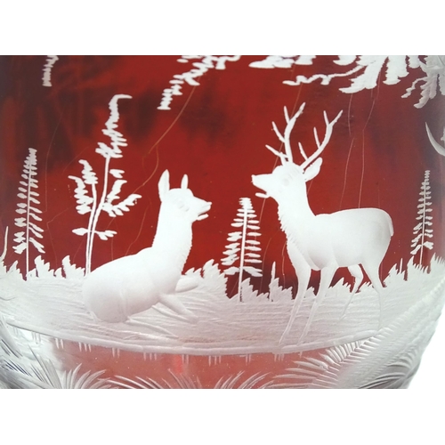 186 - A Victorian Bohemian ruby red and clear glass vase and cover with etched stag  / deer in landscape d... 