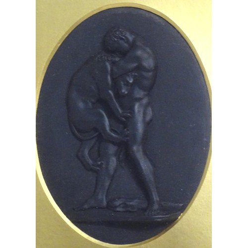 123 - A 19thC Wedgwood black basalt oval plaque depicting a classical scene with Hercules Strangling the N... 