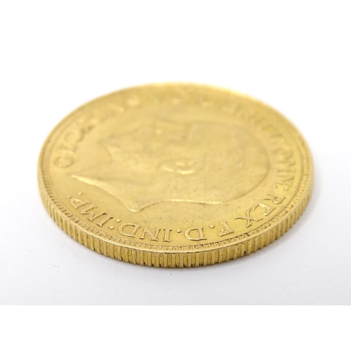 796 - Coin : A George V 1929 gold sovereign coin. Total weight approx. 8g