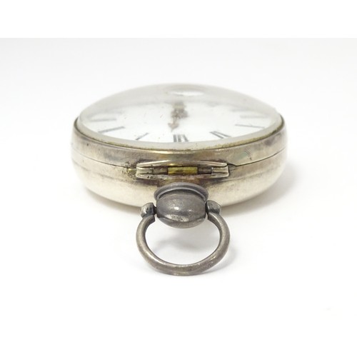 769 - A 19thC silver pair cased pocket watch, hallmarked Birmingham 1818, maker Samuel Packwood, the movem... 