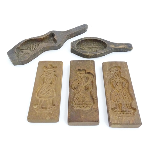 1057 - Five 19thC and later biscuit / shortbread moulds decoration to include fish, vase, figures, etc. Lar... 