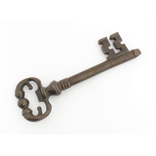 1063 - A 20thC novelty corkscrew / bottle opener modelled as an old key, titled The Key to Happiness. In or... 