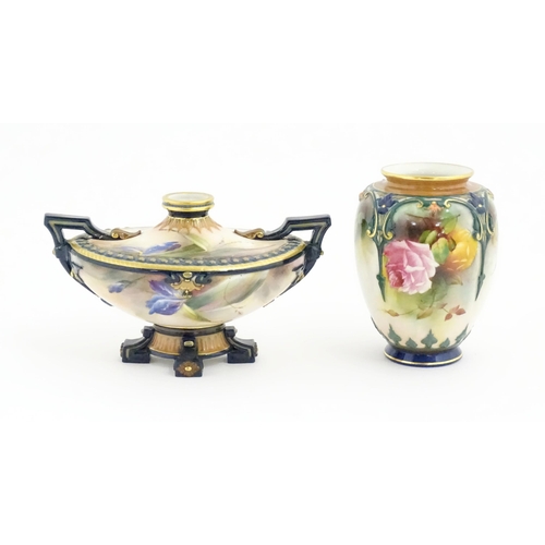 107 - A Royal Worcester vase with hand painted rose decoration. Marked under and numbered 169. Together wi... 