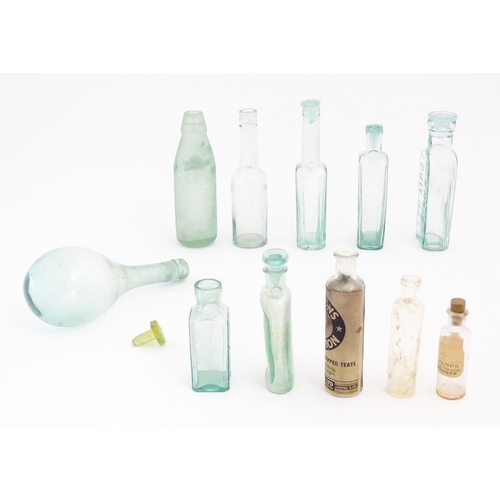 1071 - A quantity of early 20thC glass bottles, including Foster & Clarke (Maidstone) 'Eiffel Tower' lemona... 