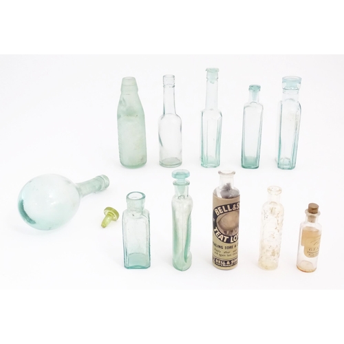 1071 - A quantity of early 20thC glass bottles, including Foster & Clarke (Maidstone) 'Eiffel Tower' lemona... 