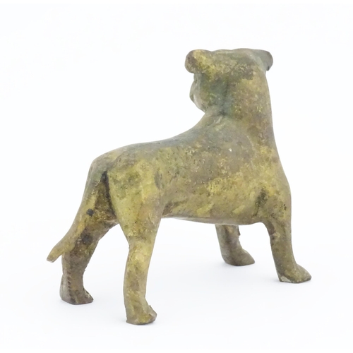 1087 - A cast model of a dog with gilt finish. Approx. 3 1/2