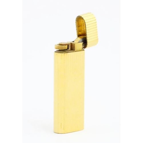 1088 - Cartier Paris : a late 20thC Must de Cartier gold plated lighter, boxed with ephemera. Serial number... 