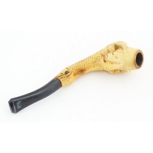 1091 - A cased Victorian carved meerschaum ladies' pipe, the stem formed as an outstretched eagle claw clut... 