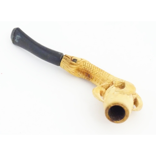 1091 - A cased Victorian carved meerschaum ladies' pipe, the stem formed as an outstretched eagle claw clut... 