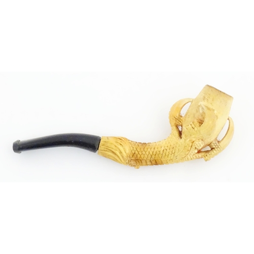 1091 - A cased Victorian carved meerschaum ladies' pipe, the stem formed as an outstretched eagle claw clut... 