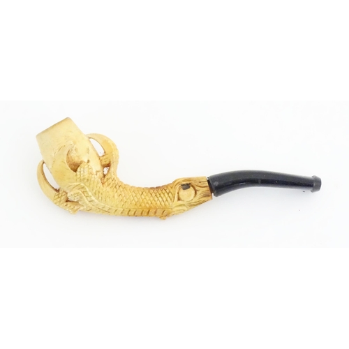 1091 - A cased Victorian carved meerschaum ladies' pipe, the stem formed as an outstretched eagle claw clut... 