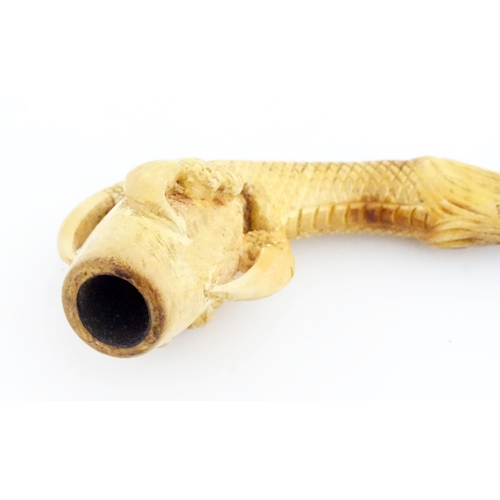 1091 - A cased Victorian carved meerschaum ladies' pipe, the stem formed as an outstretched eagle claw clut... 