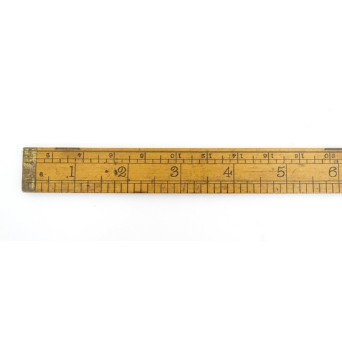 1099 - A Victorian folding boxwood and brass slide rule, no. 1506, maker J. Rabone & Sons. Approx. 12 1/2