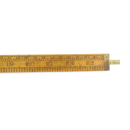 1099 - A Victorian folding boxwood and brass slide rule, no. 1506, maker J. Rabone & Sons. Approx. 12 1/2