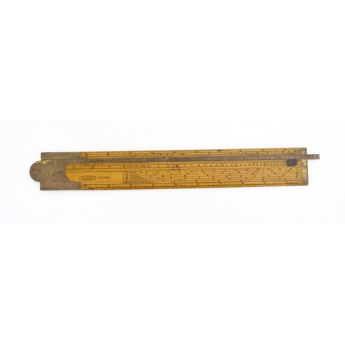 1099 - A Victorian folding boxwood and brass slide rule, no. 1506, maker J. Rabone & Sons. Approx. 12 1/2