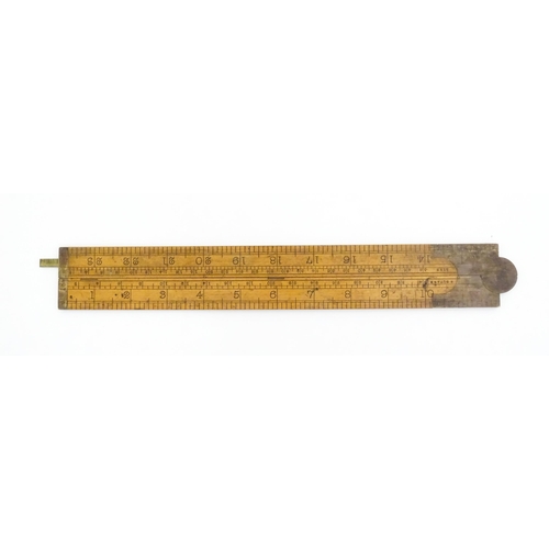 1099 - A Victorian folding boxwood and brass slide rule, no. 1506, maker J. Rabone & Sons. Approx. 12 1/2