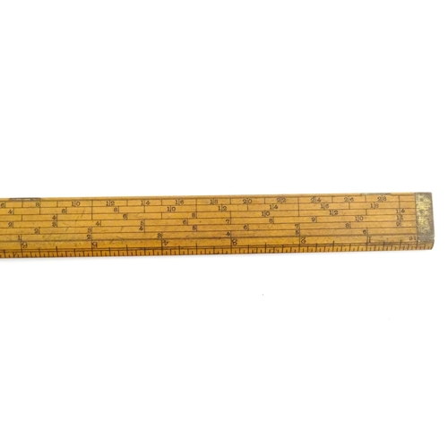 1099 - A Victorian folding boxwood and brass slide rule, no. 1506, maker J. Rabone & Sons. Approx. 12 1/2