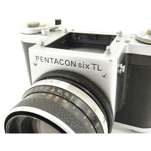 1118 - Two 20thC cameras to include a cased Pentacon Six TL camera and a Pentacon Six TL camera body (2)