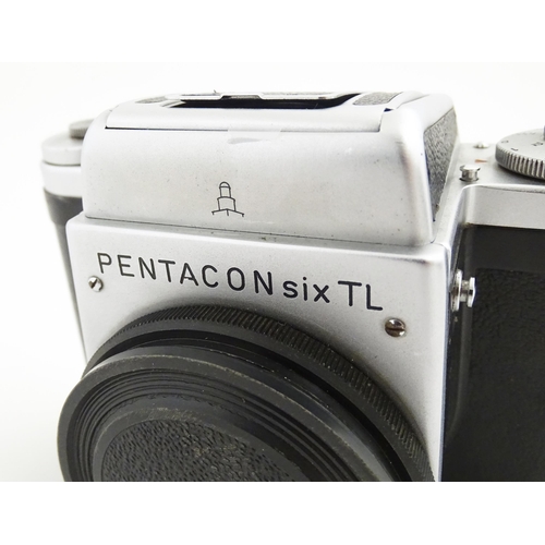 1118 - Two 20thC cameras to include a cased Pentacon Six TL camera and a Pentacon Six TL camera body (2)