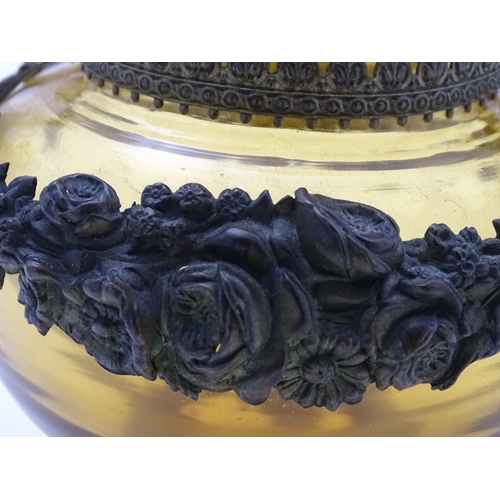 193 - A Continental amber glass vase with twin handled ormolu mount with floral swag detail. Approx 4 3/4