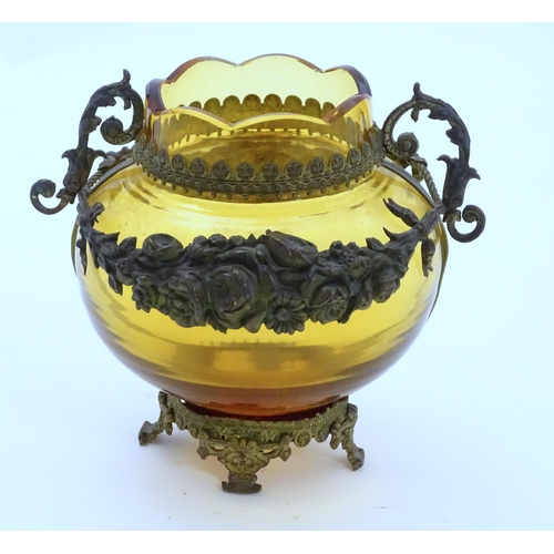 193 - A Continental amber glass vase with twin handled ormolu mount with floral swag detail. Approx 4 3/4