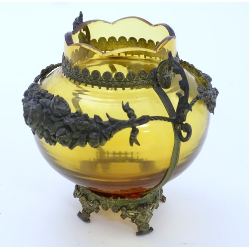 193 - A Continental amber glass vase with twin handled ormolu mount with floral swag detail. Approx 4 3/4