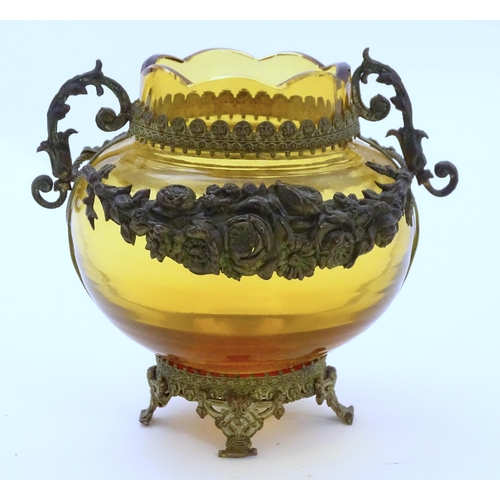 193 - A Continental amber glass vase with twin handled ormolu mount with floral swag detail. Approx 4 3/4