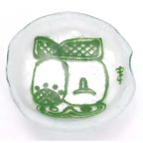 194 - An Art glass dish, the white ground with green abstract detail. Signed with monogram. Approx 4 1/2