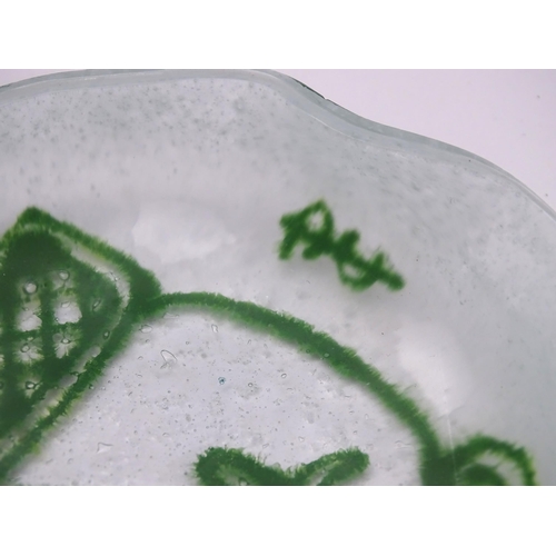 194 - An Art glass dish, the white ground with green abstract detail. Signed with monogram. Approx 4 1/2