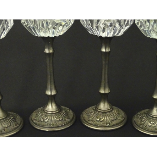 202 - A set of six Italian cut glass champagne flutes raised on  pewter stem and foot. Approx 11