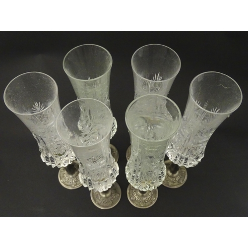 202 - A set of six Italian cut glass champagne flutes raised on  pewter stem and foot. Approx 11