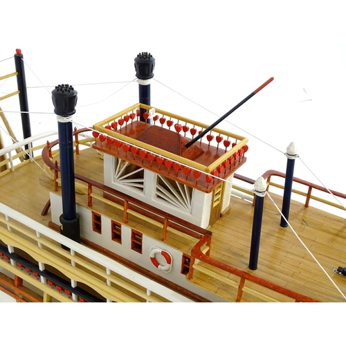 819 - A 20thC scratch built scale model of a 19thC paddle steamer boat , ' Mississippi Swan' , of wooden c... 