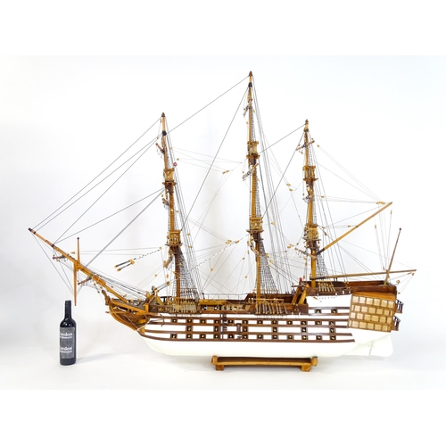 820 - A 20thC large scratch built scale model of a late 18thC war ship/ tall ship, with 74 guns over three... 