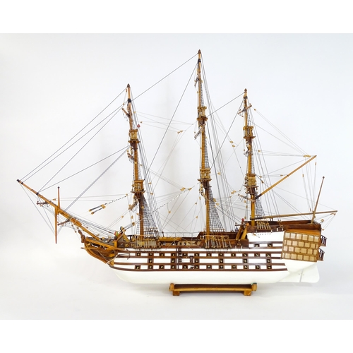 820 - A 20thC large scratch built scale model of a late 18thC war ship/ tall ship, with 74 guns over three... 