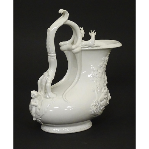 72 - A Continental white glazed jug with relief decoration depicting a wild boar hunt, the rim with goat ... 