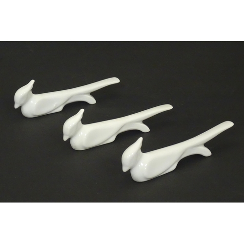 73 - Three Art Deco ceramic knife rests modelled as stylised birds. Approx. 5