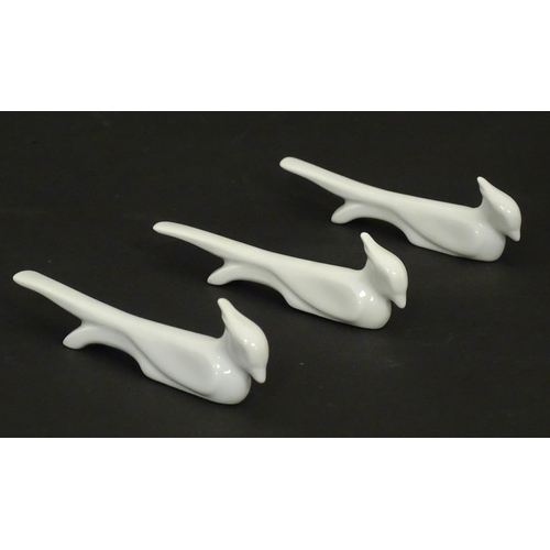 73 - Three Art Deco ceramic knife rests modelled as stylised birds. Approx. 5