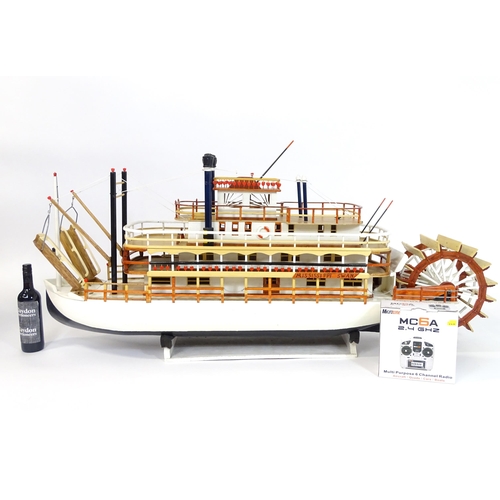 819 - A 20thC scratch built scale model of a 19thC paddle steamer boat , ' Mississippi Swan' , of wooden c... 